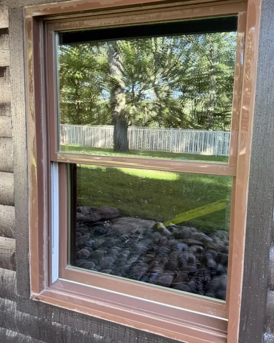 The same window with clean glass and a clean frame after cleaning