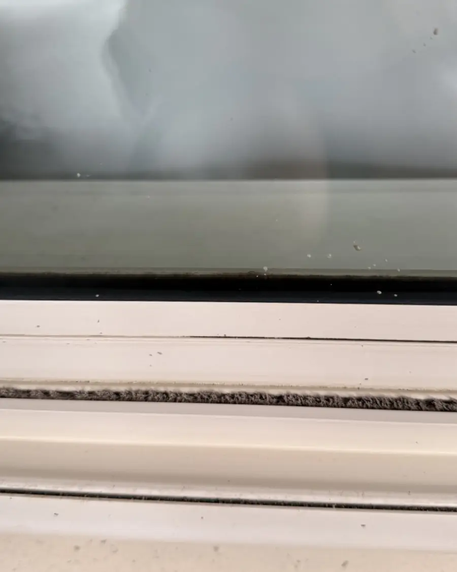 The same window track cleaned out and left white